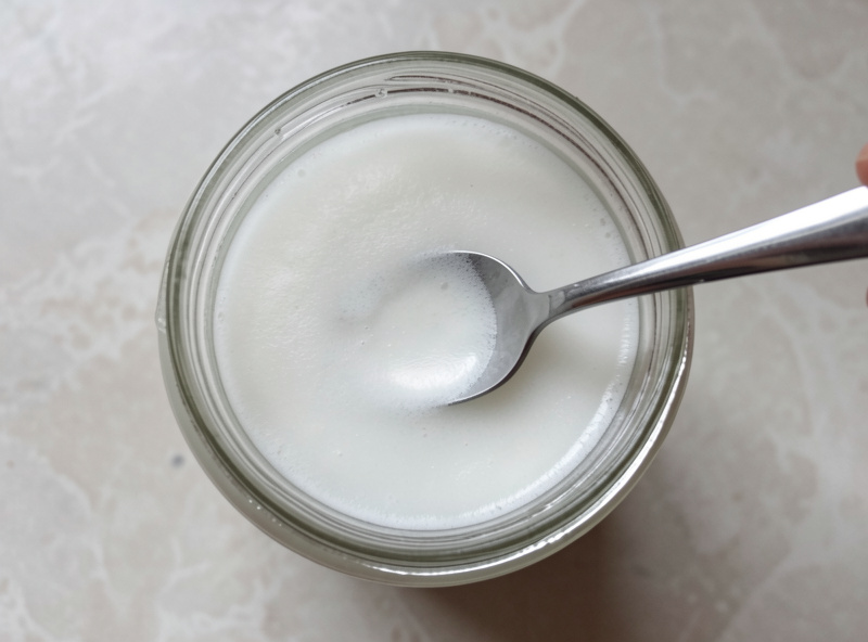 A thin harmless white film on the surface of a brine being skimmed with a clean spoon